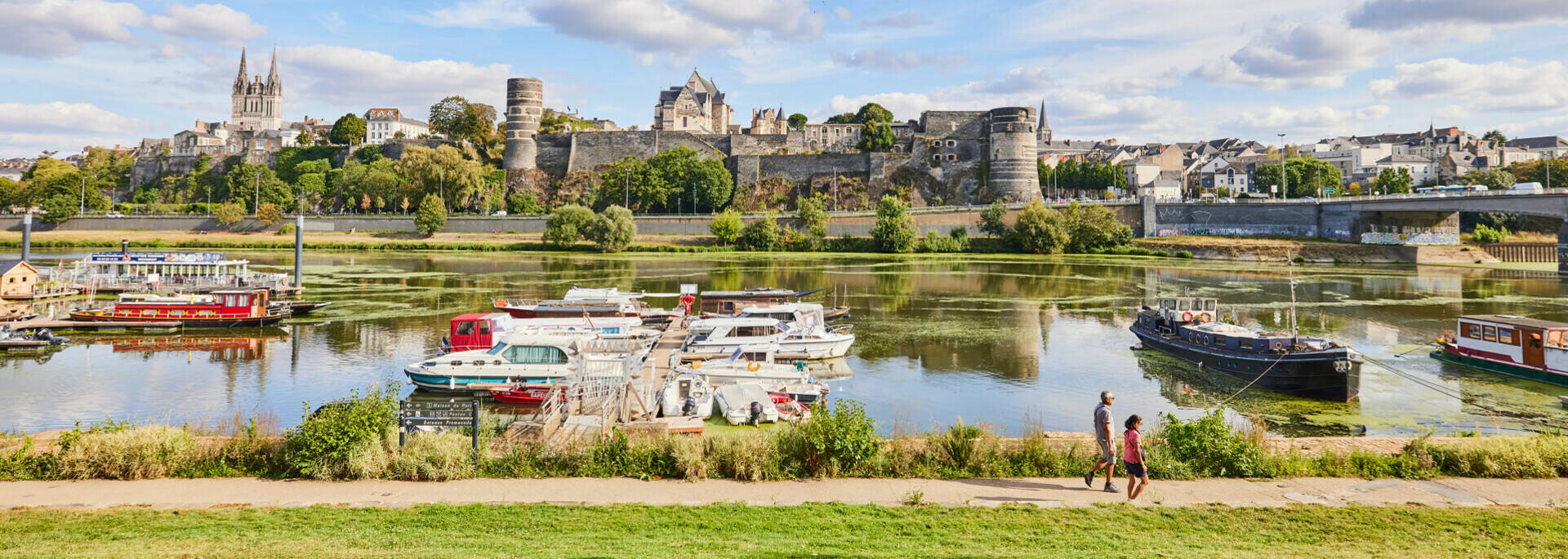 Wide shot of the port with a view of the castle and cathedral of Angers