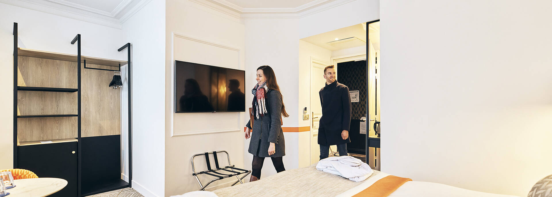 Couple entering their hotel room