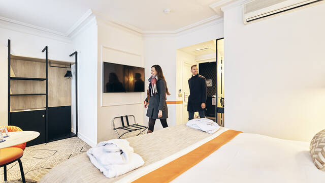 Couple entering their hotel room