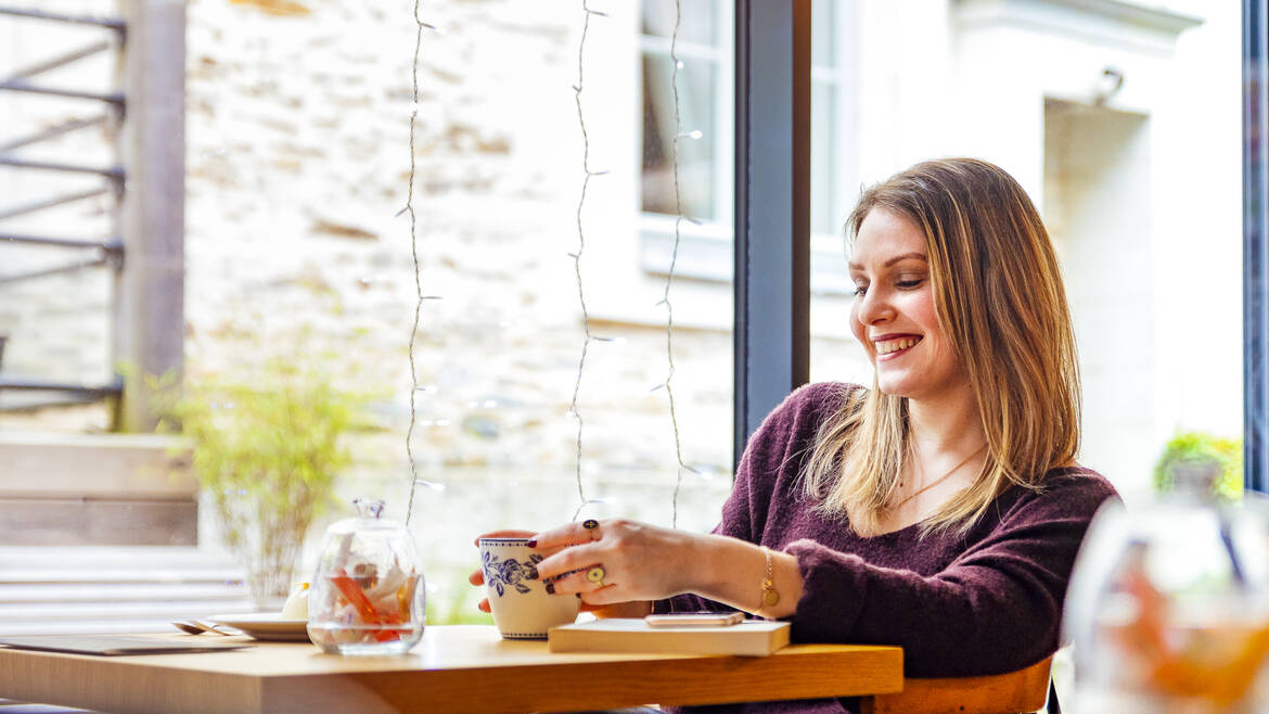 Young women at a table in a tea room