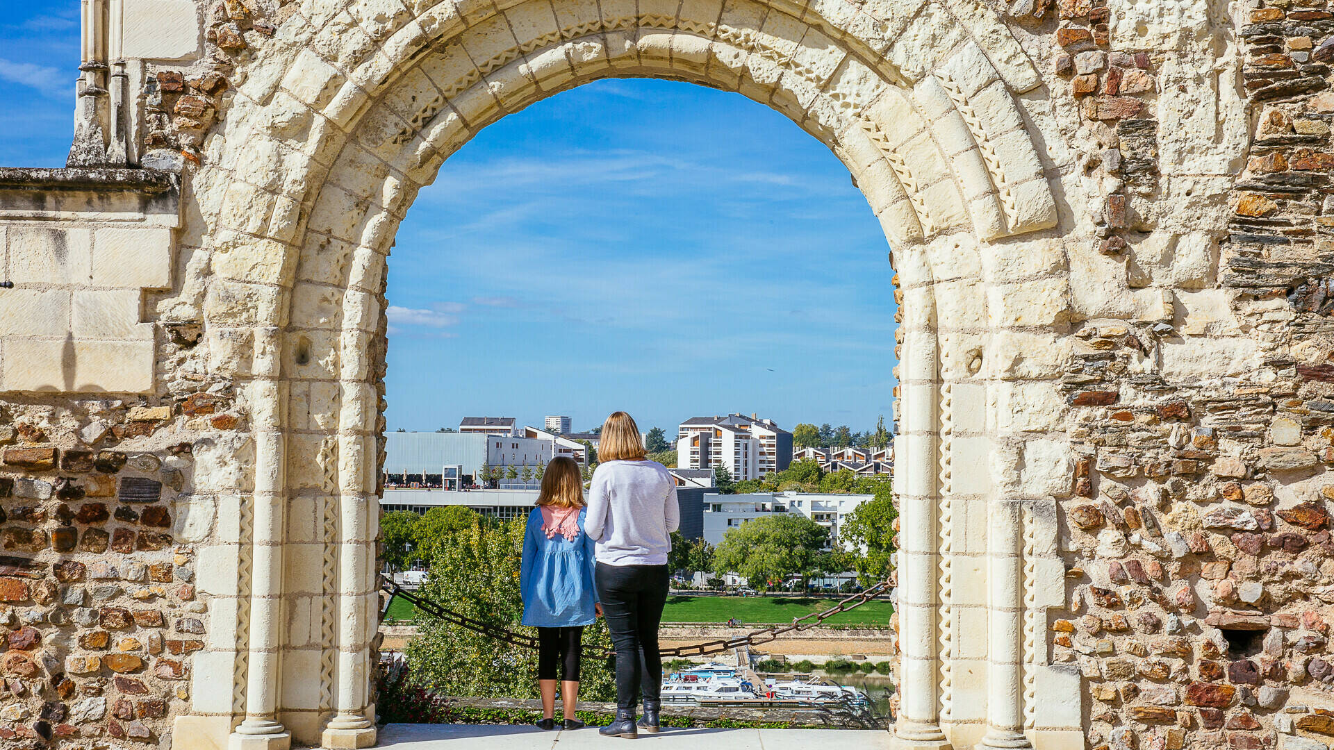A mother and daughter enjoying the view of the Doutre district