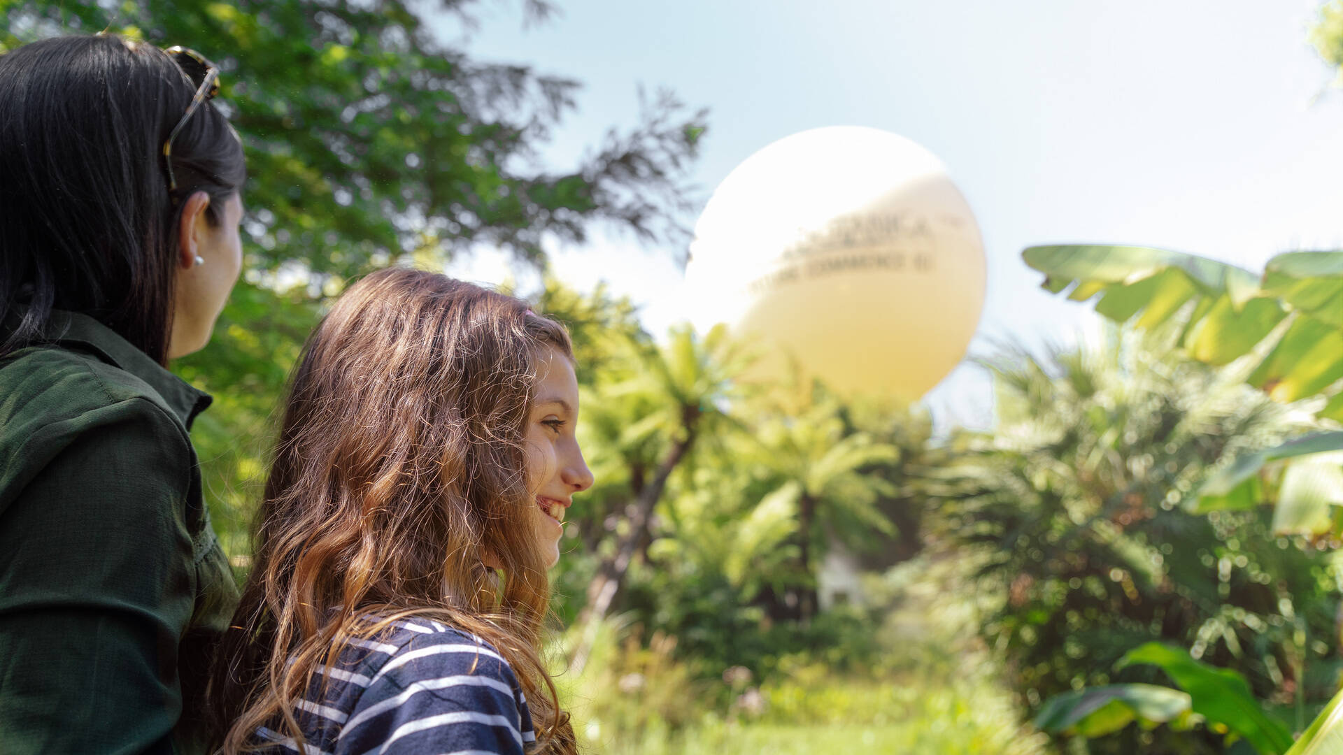 Mother and daughter in front of the Terra Botanica balloon
